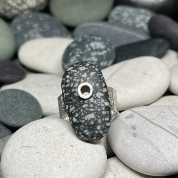 Speckled grey riveted ring